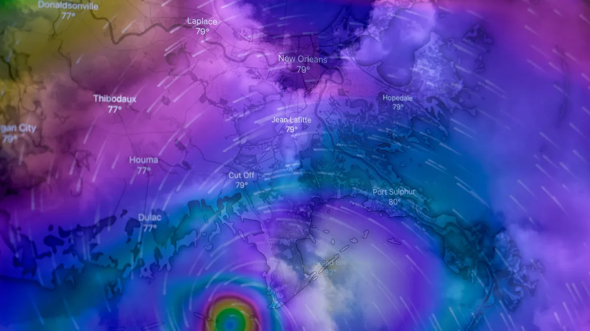 A hurricane with a large eye and swirling clouds, set against a map of the United States.